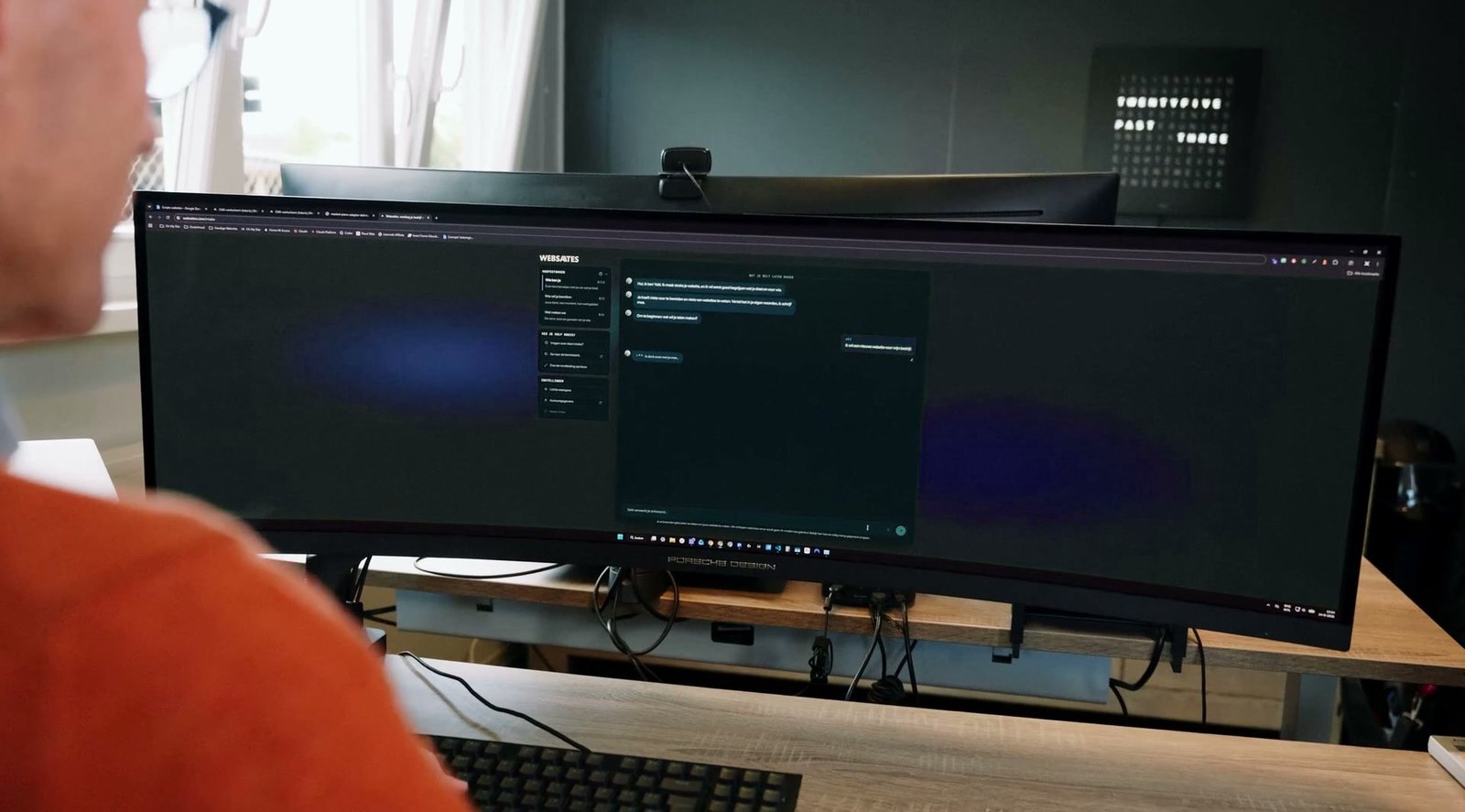 Over the shoulder of someone looking at a wide screen
